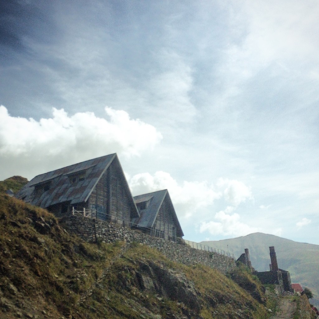 These dilapidated shacks probably command a pretty excellent view of the mountains.